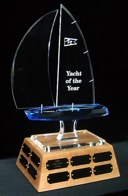 Perpetual trophy with an angled, wooden base, 20 plates